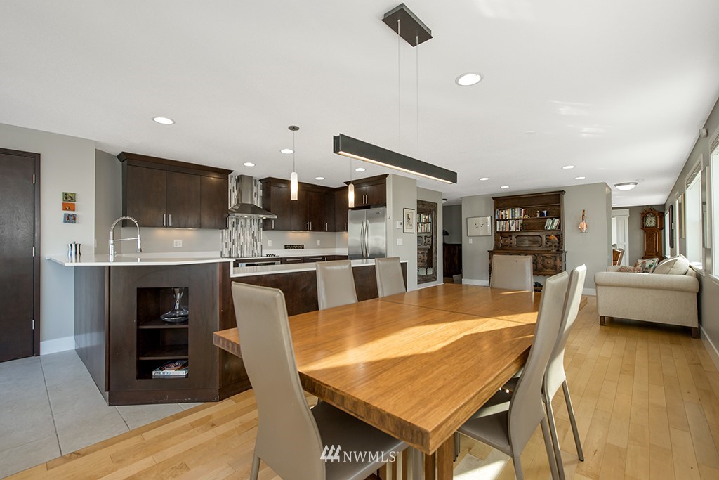 710 West Howe Street Seattle, WA 98119 - Photo 14 of 40 a large kitchen with a table and chairs