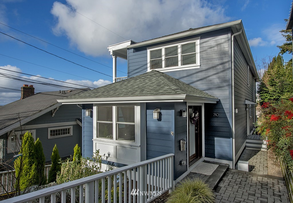 710 West Howe Street Seattle, WA 98119 - Photo 3 of 40 a front view of a house with a porch