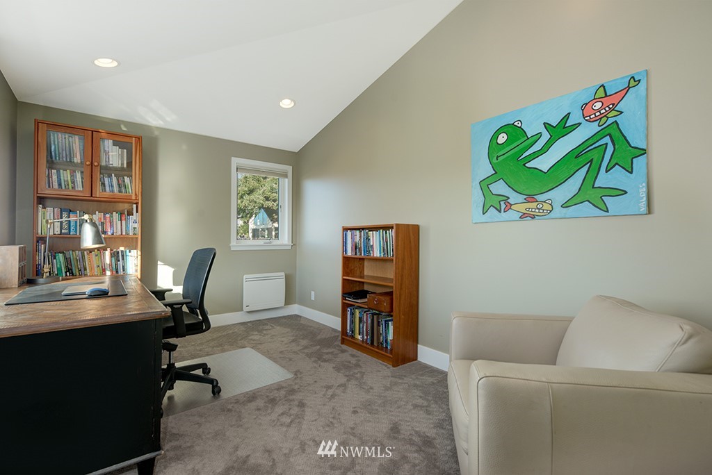 710 West Howe Street Seattle, WA 98119 - Photo 23 of 40 a work room with furniture and book shelf
