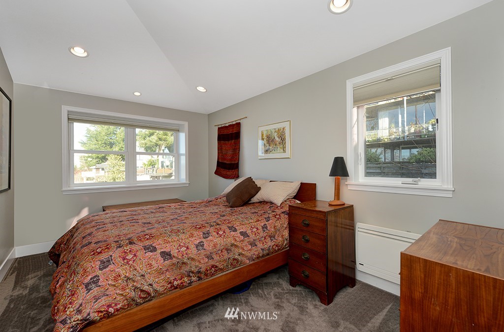 710 West Howe Street Seattle, WA 98119 - Photo 25 of 40 a bedroom with a bed and a window
