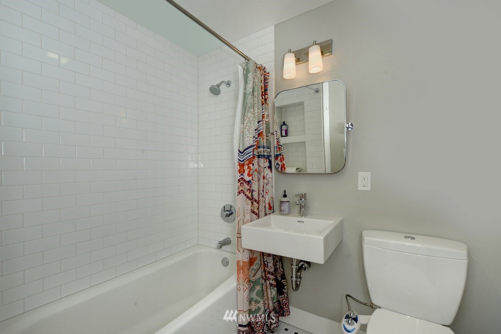710 West Howe Street Seattle, WA 98119 - Photo 26 of 40 a bathroom with a sink toilet and shower