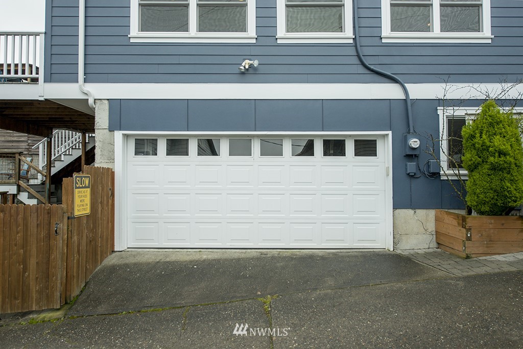 710 West Howe Street Seattle, WA 98119 - Photo 32 of 40 a front view of a house with a parking space