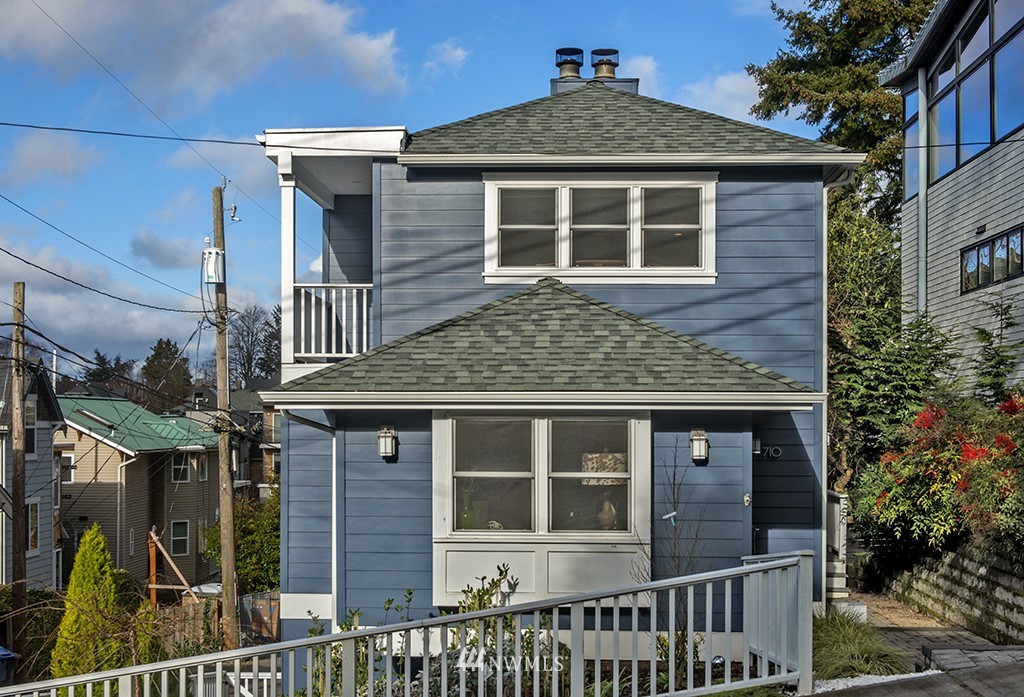 710 West Howe Street Seattle, WA 98119 - Photo 40 of 40 a front view of a house with glass windows and garage