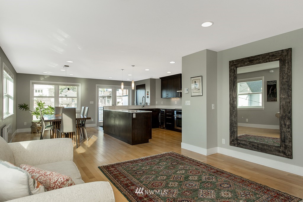710 West Howe Street Seattle, WA 98119 - Photo 9 of 40 a living room with furniture and a rug