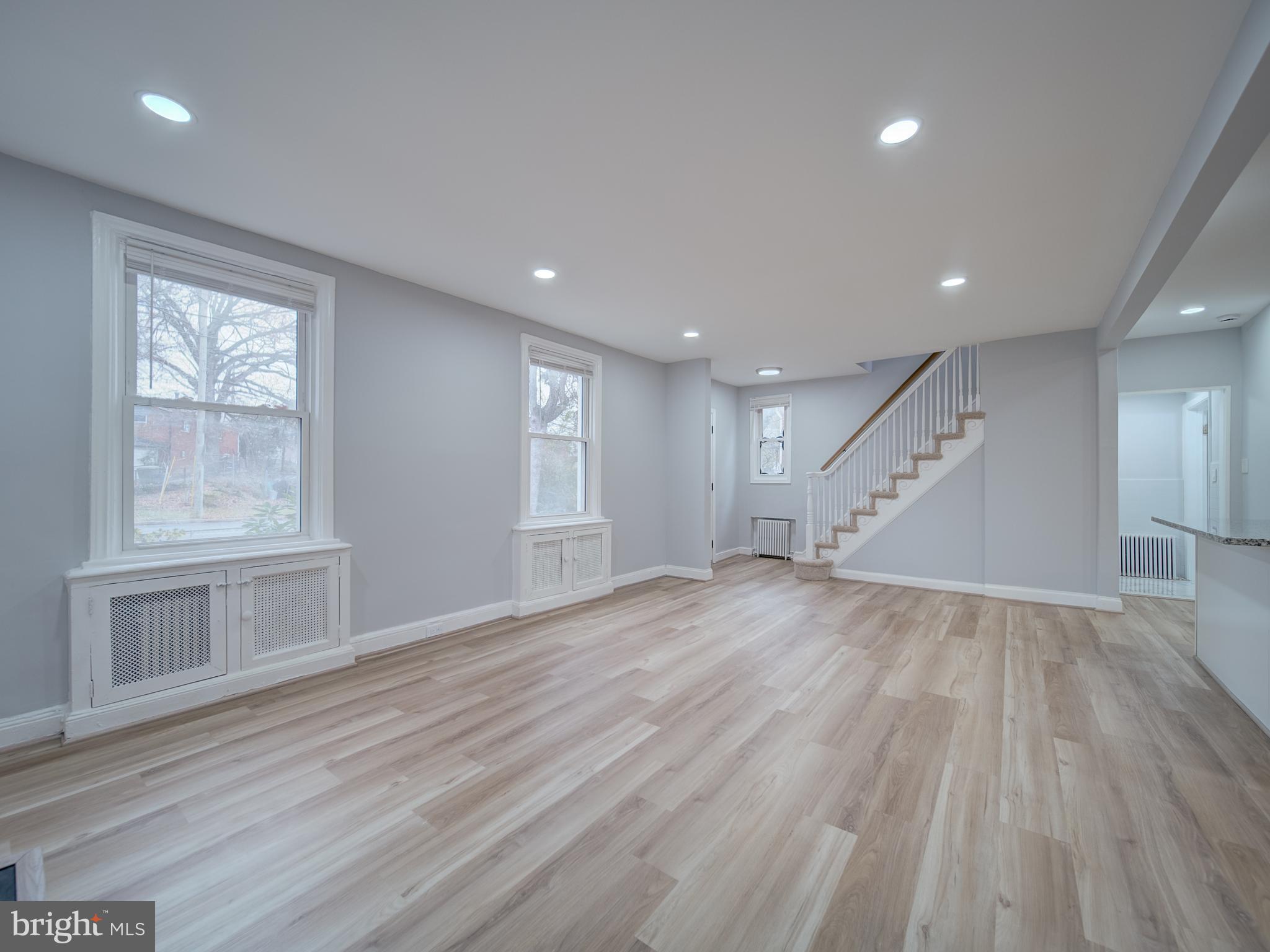 4308 Alabama Avenue Southeast Washington, DC 20019 - Photo 14 of 47 an empty room with wooden floor and windows