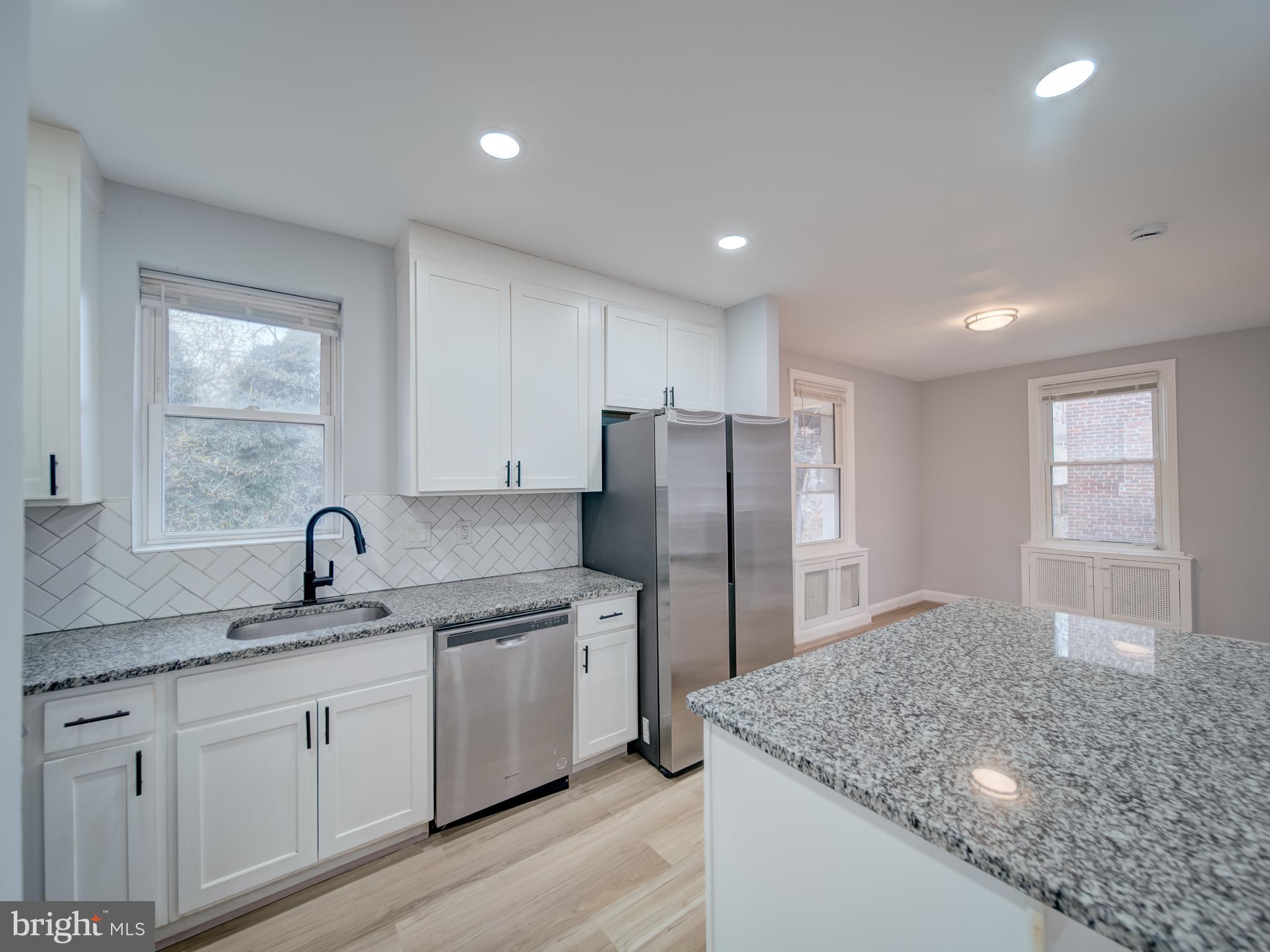 4308 Alabama Avenue Southeast Washington, DC 20019 - Photo 17 of 47 a kitchen with a sink a refrigerator and window