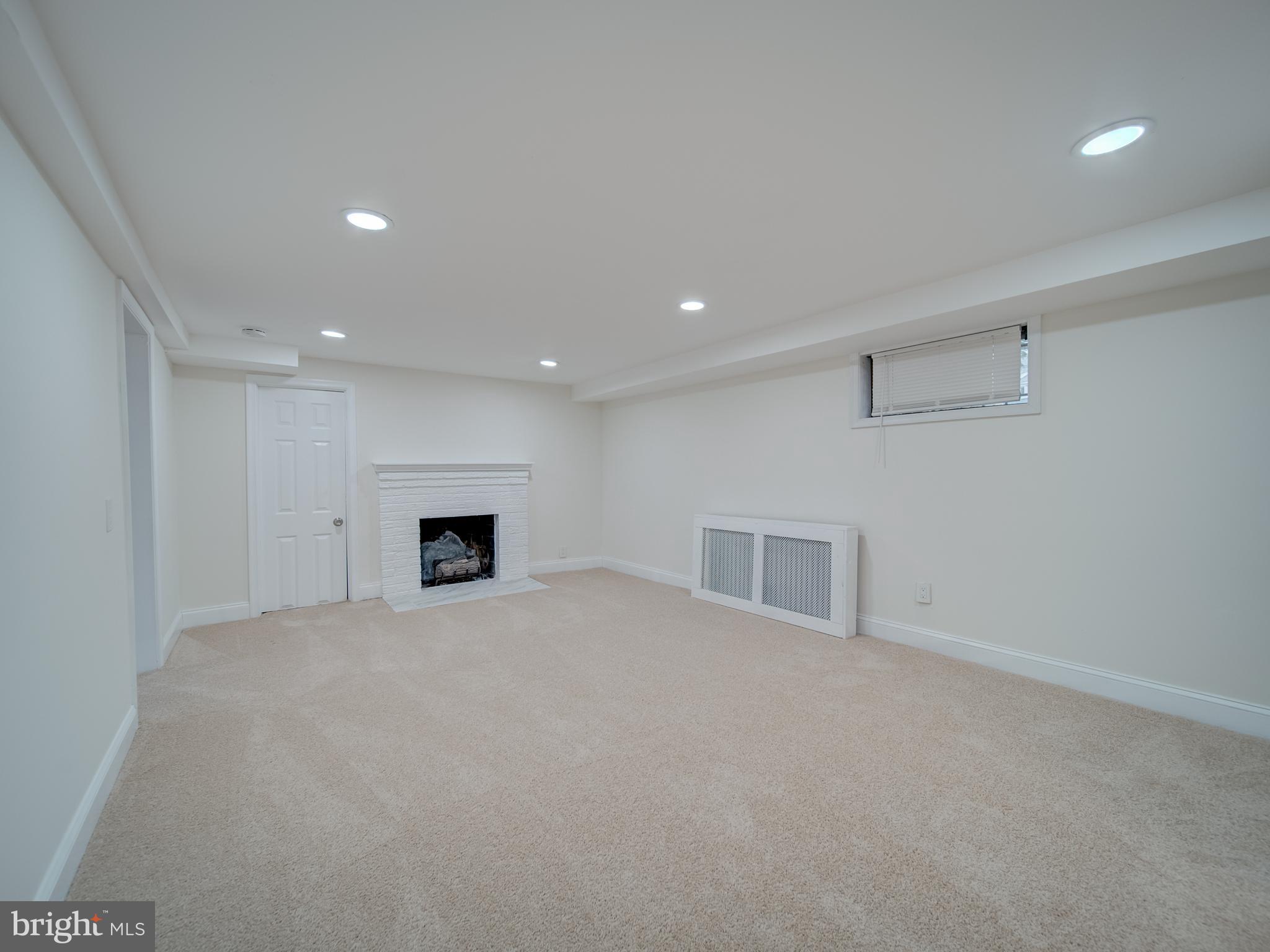 4308 Alabama Avenue Southeast Washington, DC 20019 - Photo 24 of 47 a view of an empty room with a fireplace
