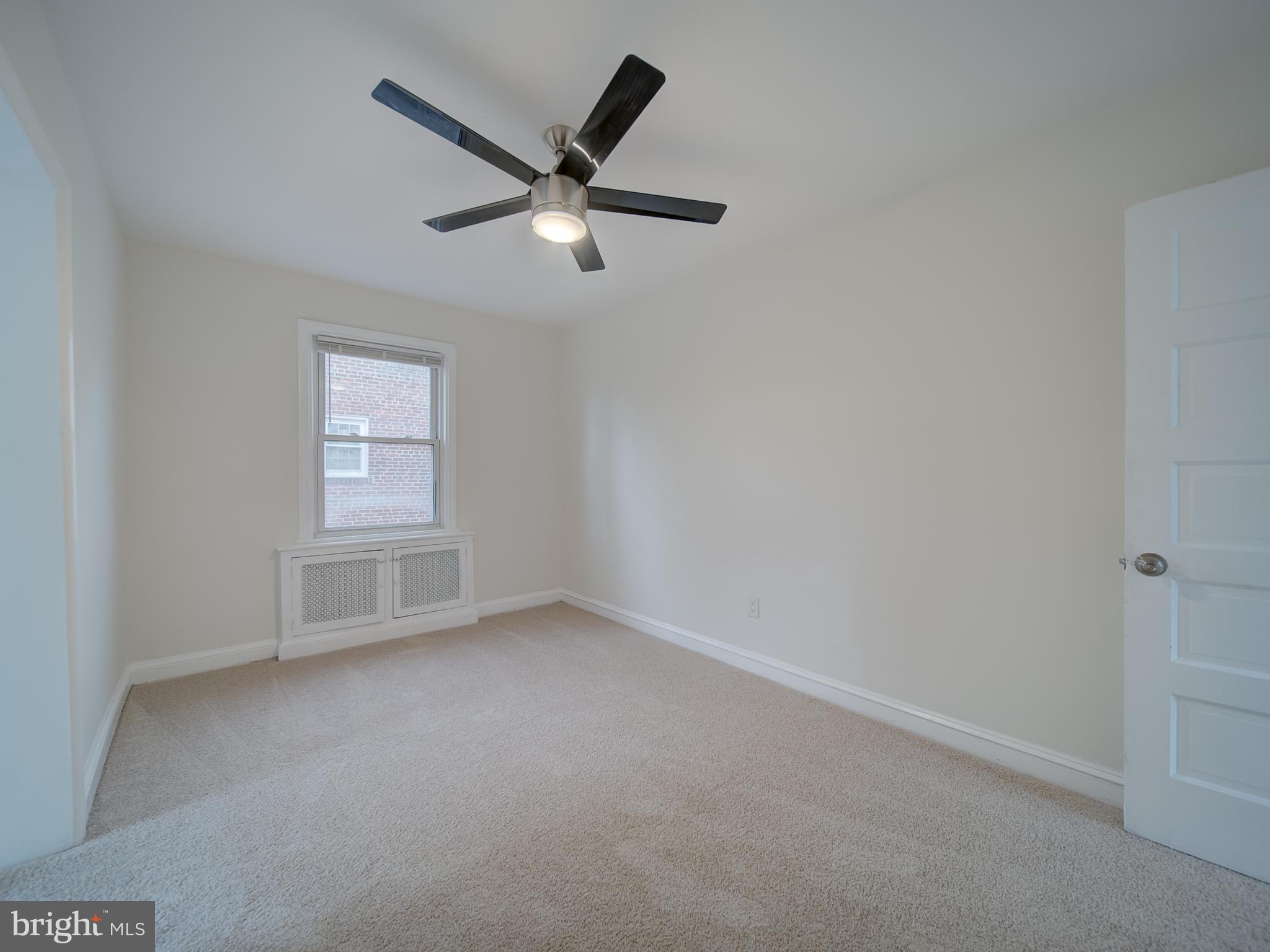 4308 Alabama Avenue Southeast Washington, DC 20019 - Photo 34 of 47 an empty room with a window and a fan