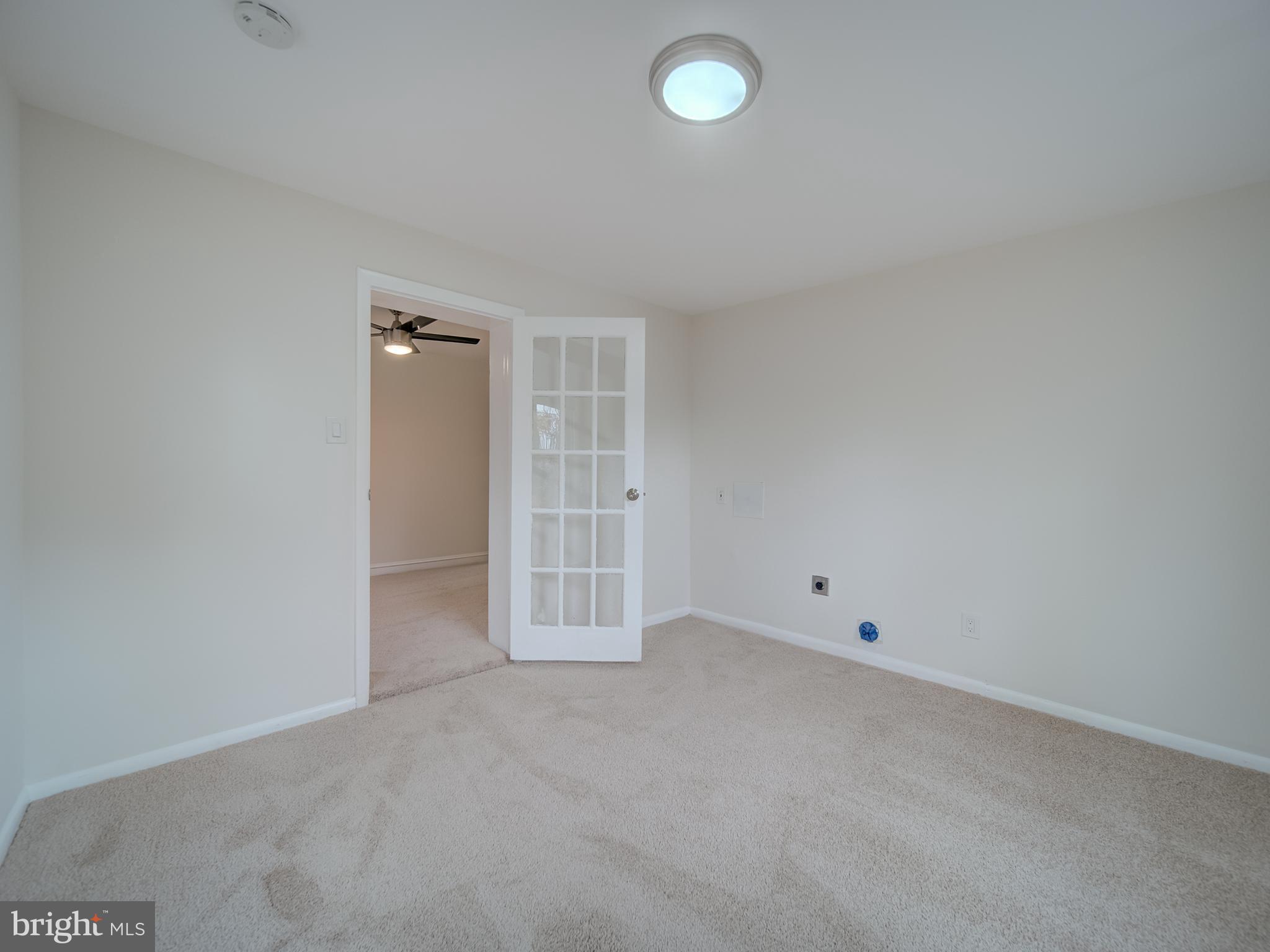 4308 Alabama Avenue Southeast Washington, DC 20019 - Photo 37 of 47 an empty room with an empty space and wooden floor
