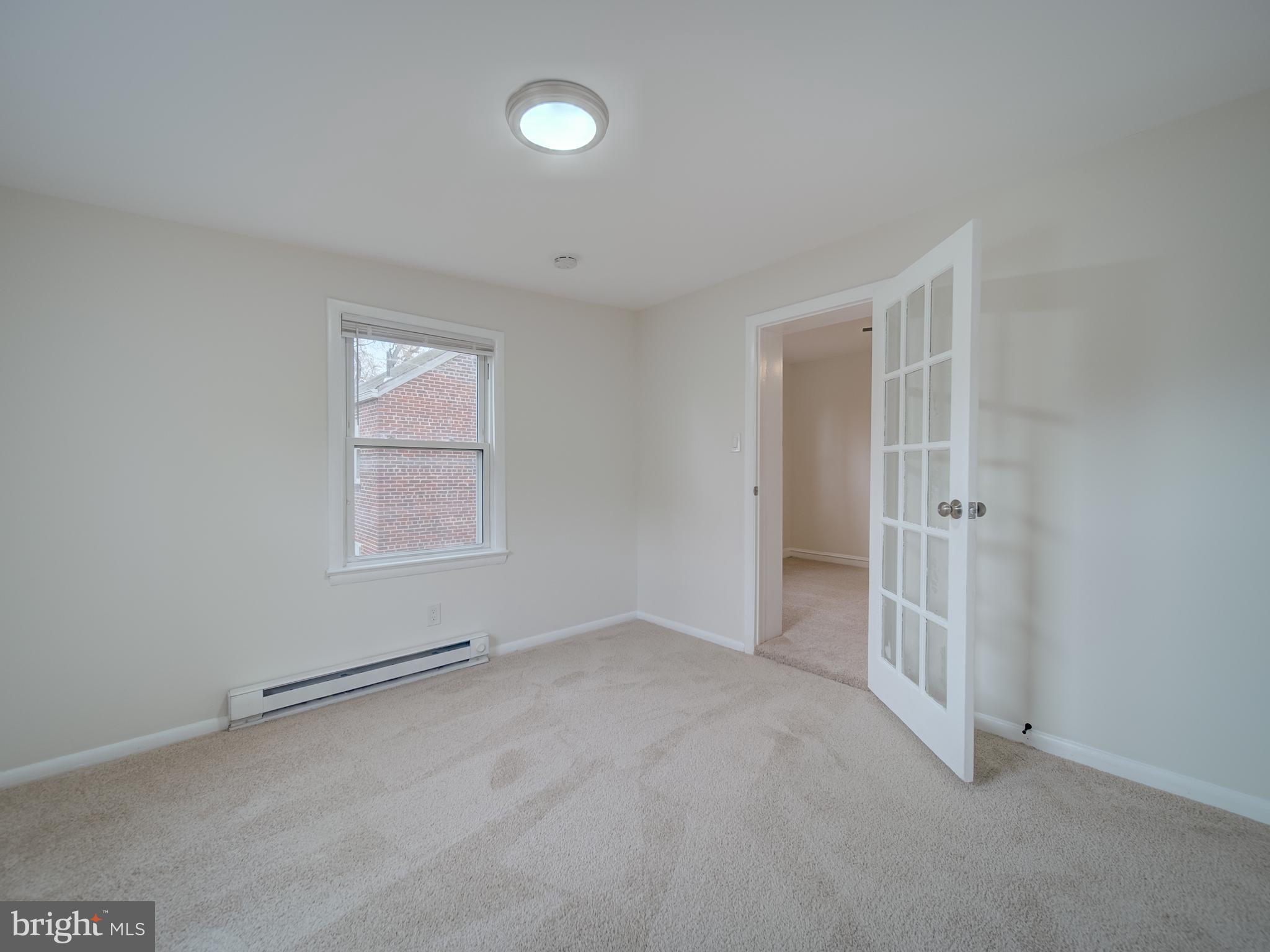 4308 Alabama Avenue Southeast Washington, DC 20019 - Photo 38 of 47 an empty room with windows