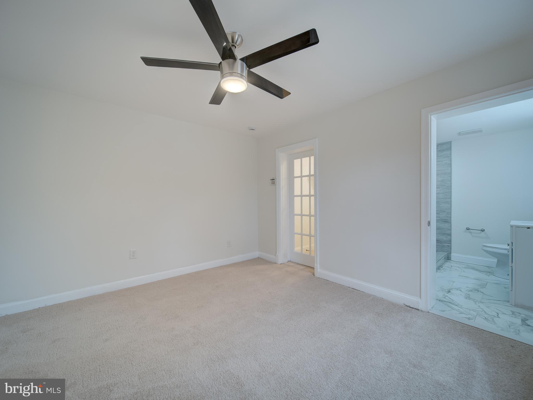 4308 Alabama Avenue Southeast Washington, DC 20019 - Photo 42 of 47 an empty room with closet and windows