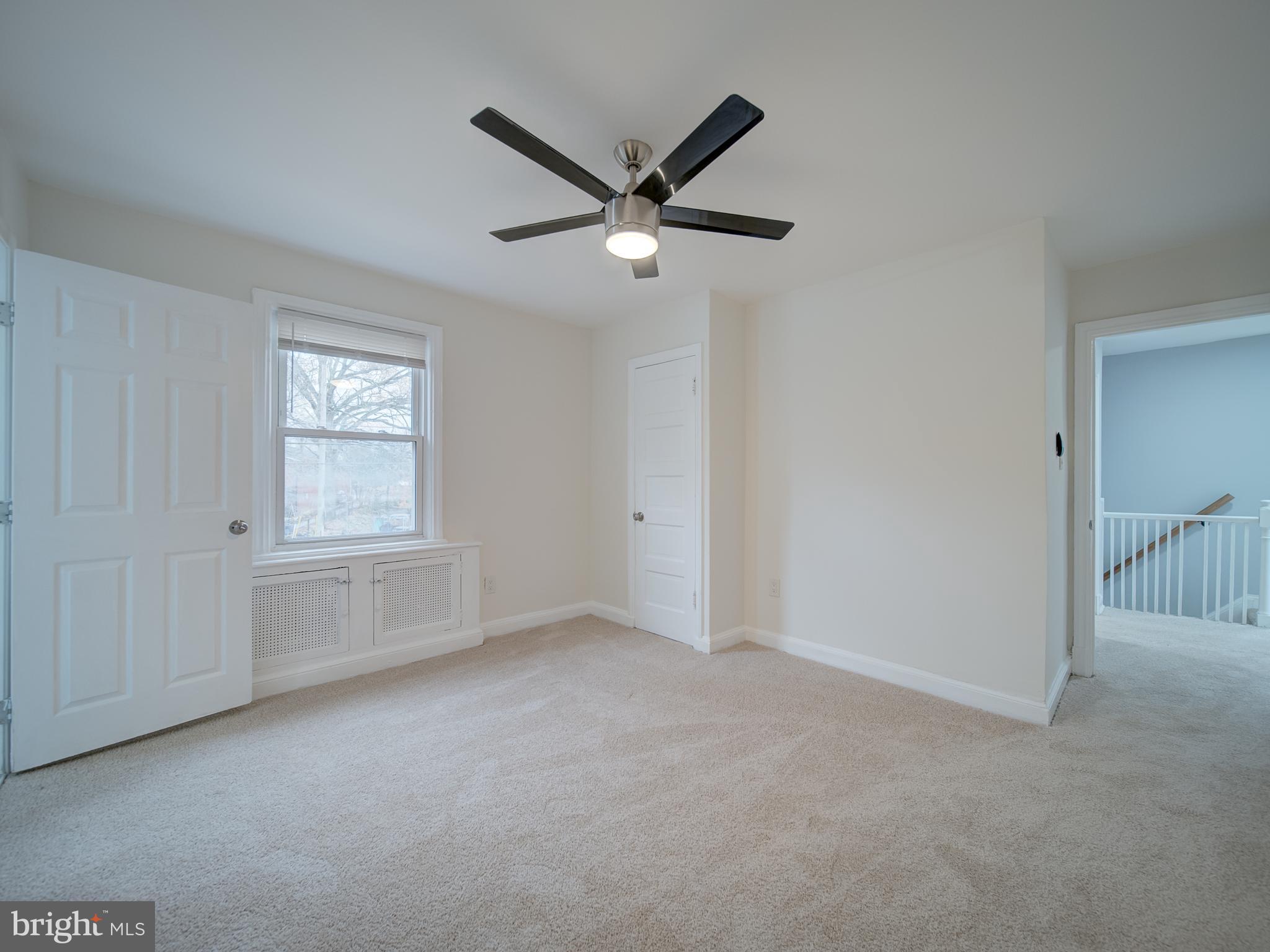 4308 Alabama Avenue Southeast Washington, DC 20019 - Photo 43 of 47 a view of empty room with a ceiling fan