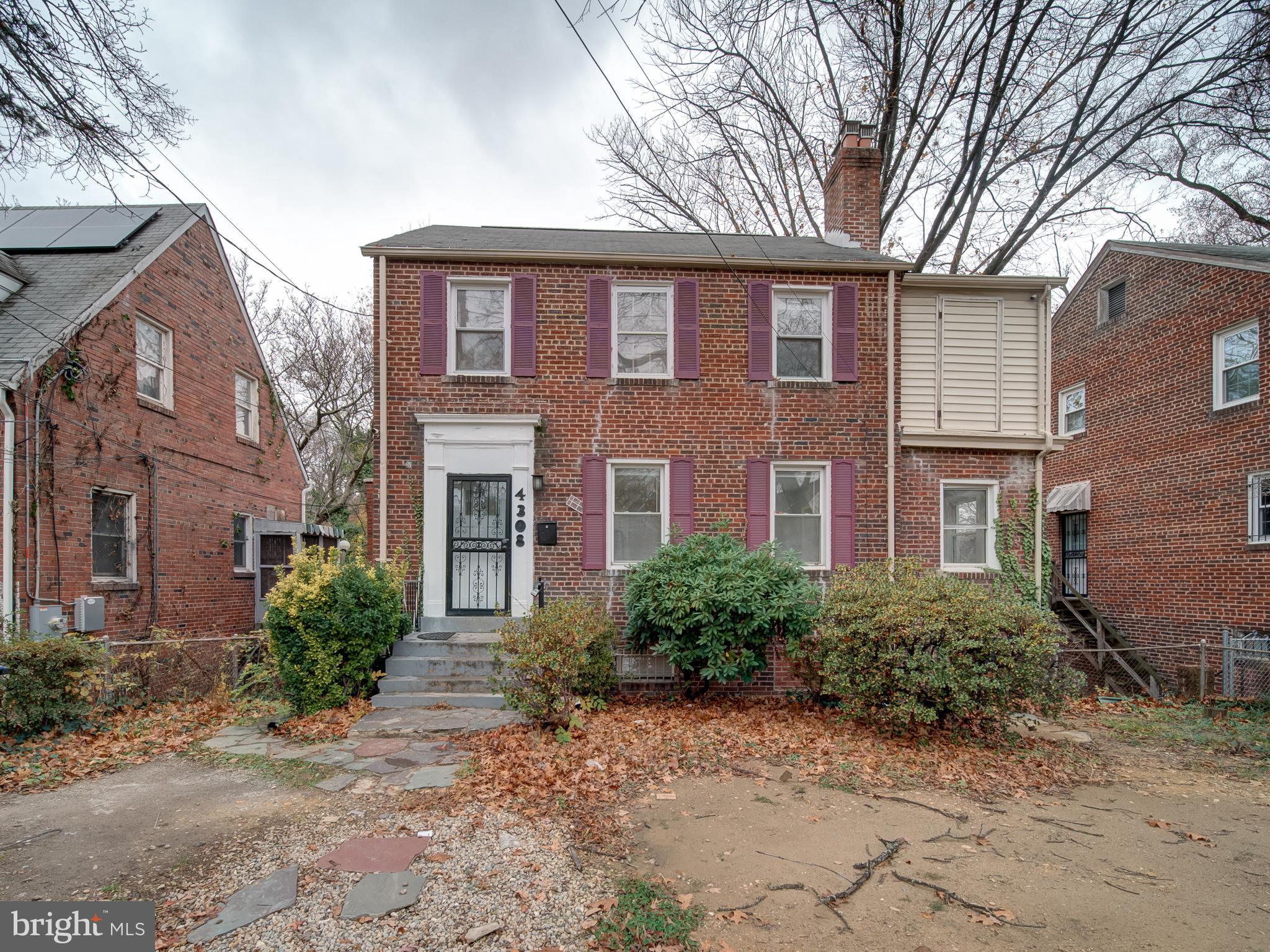 4308 Alabama Avenue Southeast Washington, DC 20019 - Photo 7 of 47 a front view of a house with garden