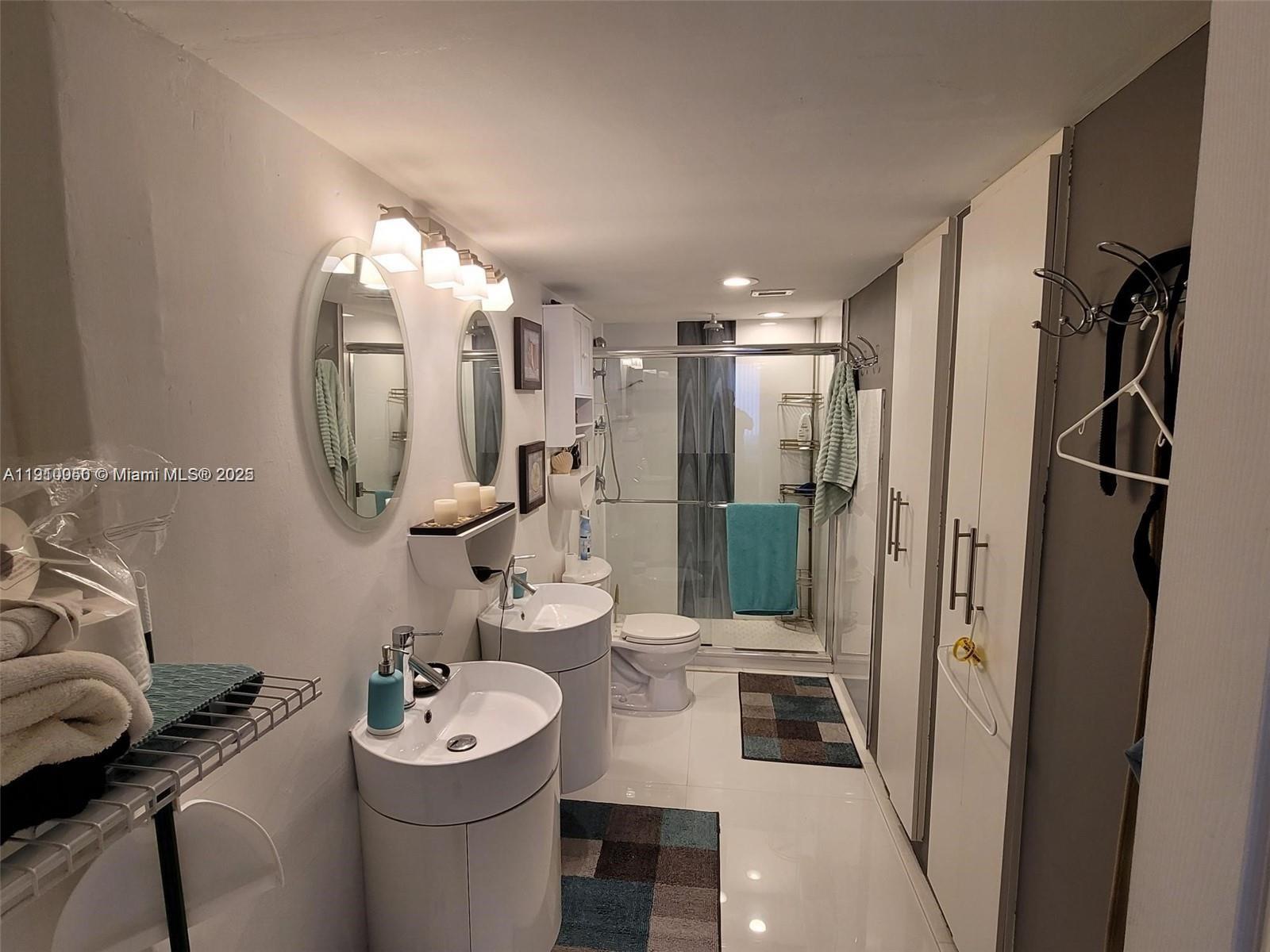 2030 South Ocean Drive, Unit 1815 Hallandale Beach, FL 33009 - Photo 14 of 20 a bathroom with a sink mirror vanity and toilet