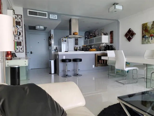 a kitchen with a stove a sink and cabinets