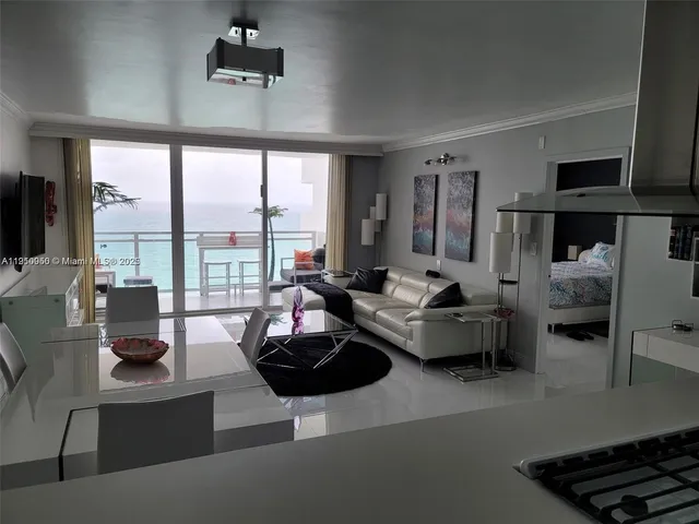 a kitchen with stove a sink and cabinets