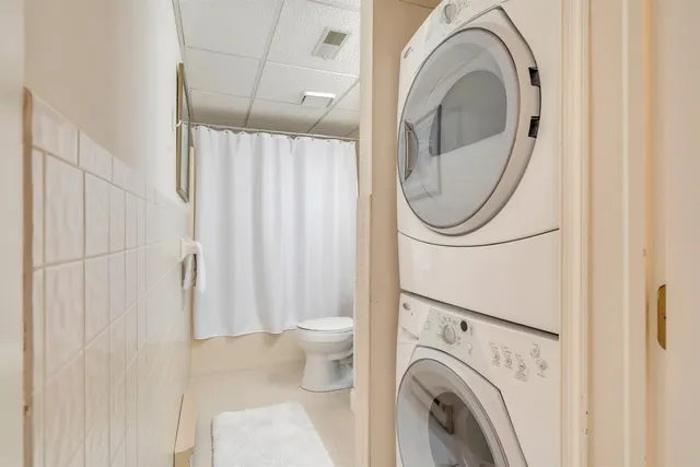 a bathroom with a toilet and a mirror