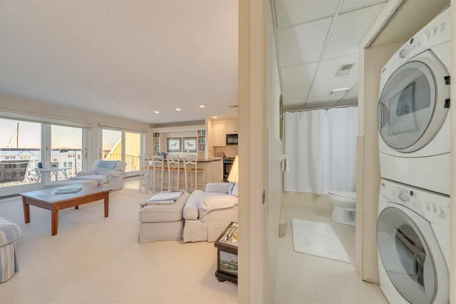a living room with furniture a ceiling fan and a fireplace