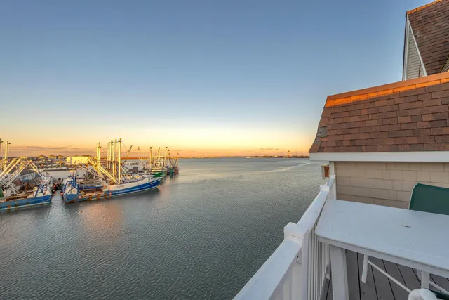 a front view of a house with sitting area