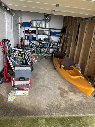 a view of a lake with a table and chairs