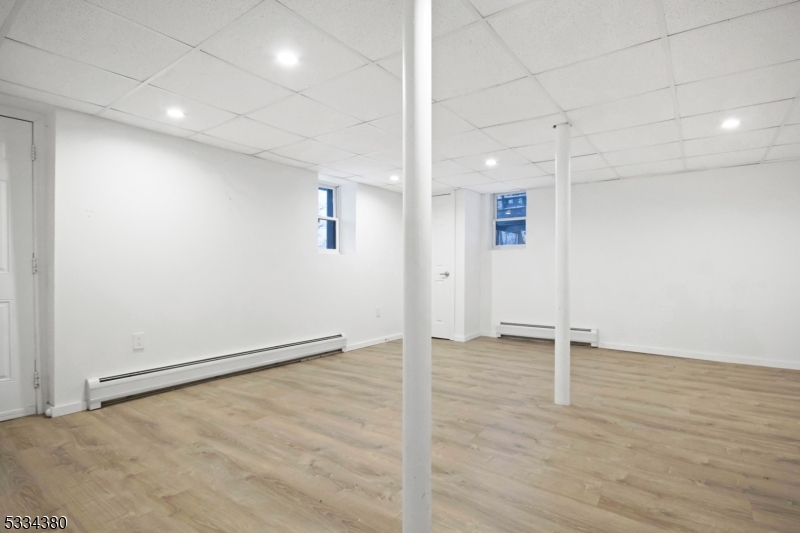 519 East Shore Trail Sparta, NJ 07871 - Photo 18 of 22 an empty room with wooden floor and white walls