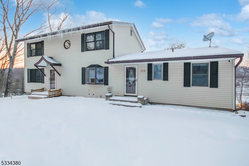 519 East Shore Trail Sparta, NJ 07871 - Photo 20 of 22 a front view of a house with garage