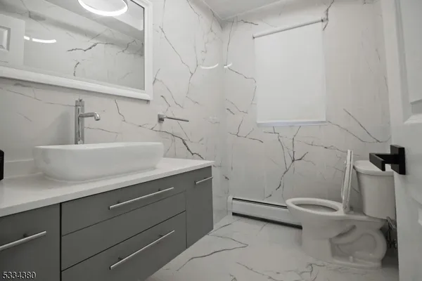 a bathroom with a sink and toilet