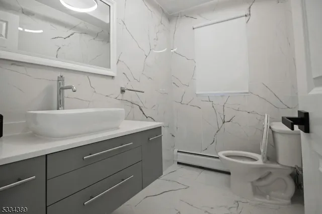 a bathroom with a sink and toilet