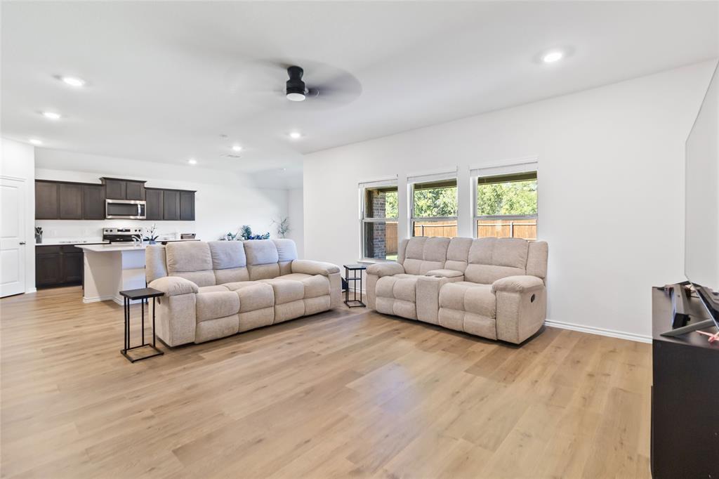 103 Mapleoak Drive Caddo Mills, TX 75135 - Photo 12 of 31 a living room with furniture and a large window
