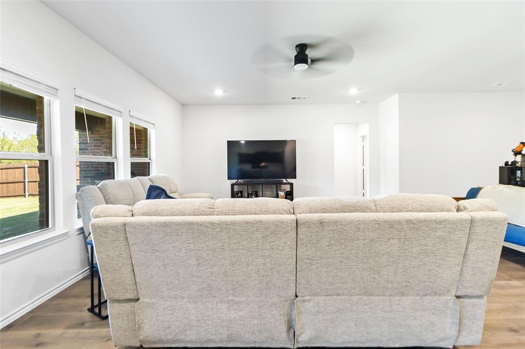 103 Mapleoak Drive Caddo Mills, TX 75135 - Photo 16 of 31 a living room with furniture and a flat screen tv