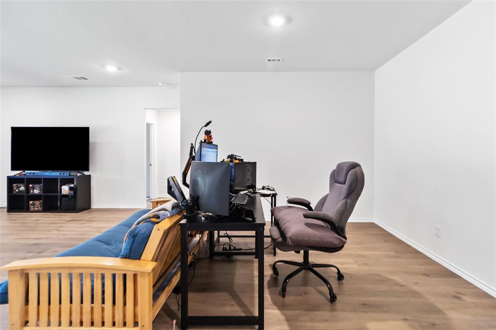 103 Mapleoak Drive Caddo Mills, TX 75135 - Photo 17 of 31 a view of a livingroom with furniture and a flat screen tv