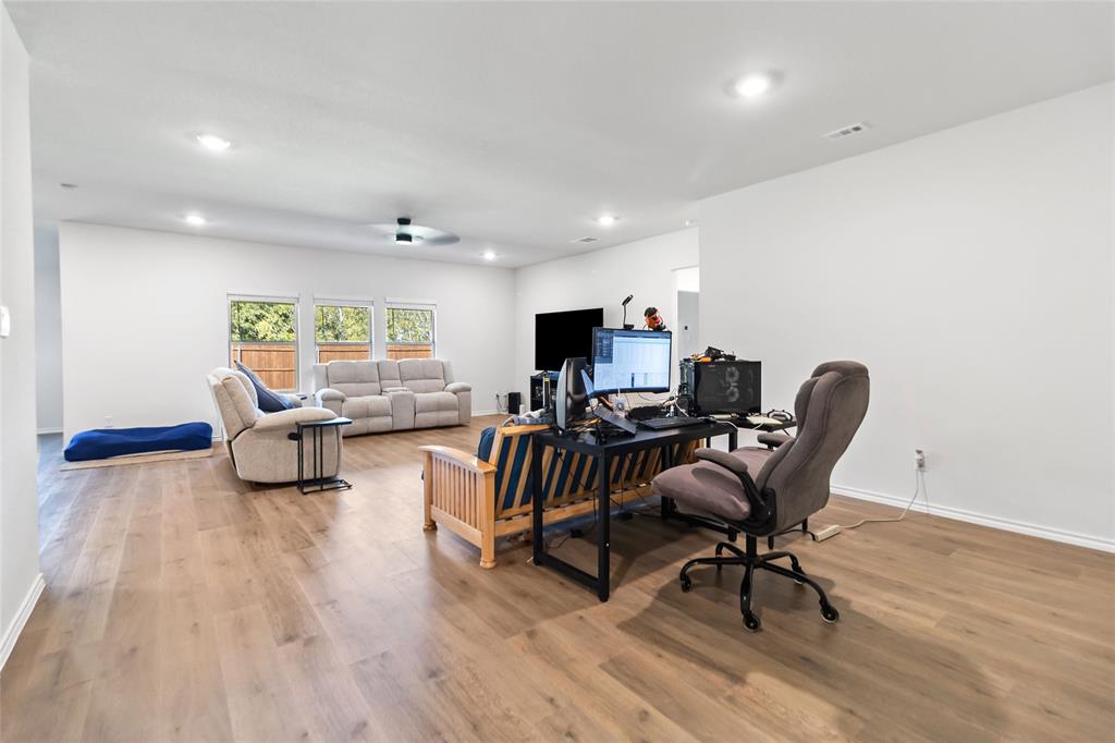 103 Mapleoak Drive Caddo Mills, TX 75135 - Photo 18 of 31 a workspace with furniture hardwood and a window