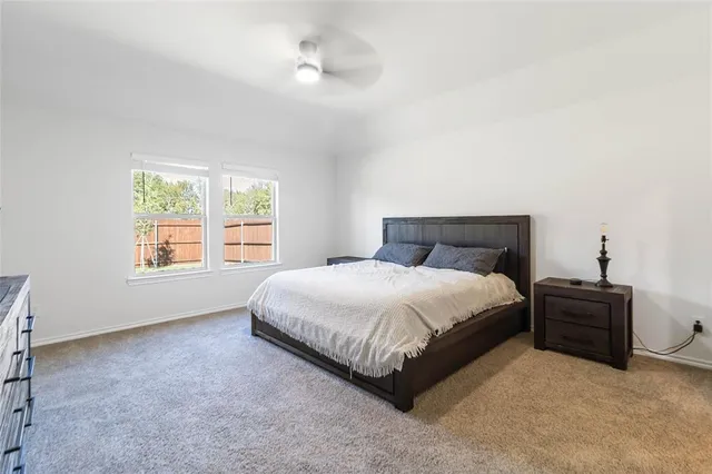 a bedroom with a bed and window