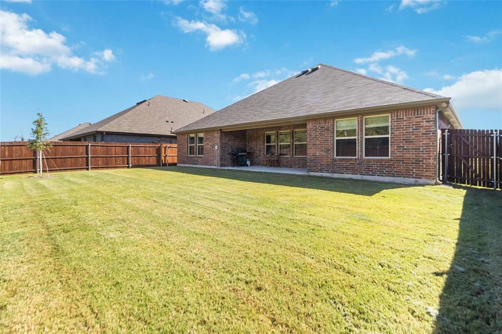 103 Mapleoak Drive Caddo Mills, TX 75135 - Photo 30 of 31 a view of a house with a yard and potted plants