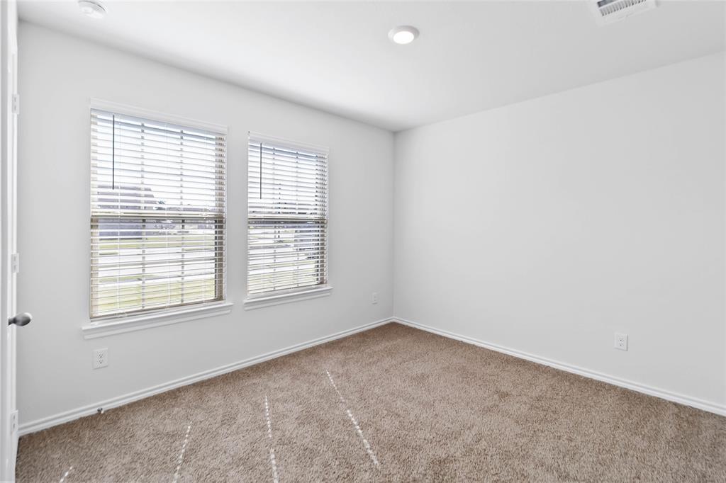 103 Mapleoak Drive Caddo Mills, TX 75135 - Photo 4 of 31 an empty room with a window
