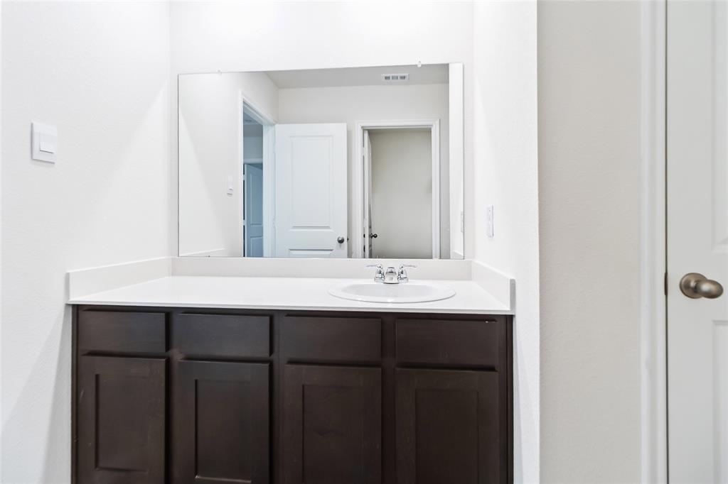 103 Mapleoak Drive Caddo Mills, TX 75135 - Photo 6 of 31 a bathroom with a sink and a mirror