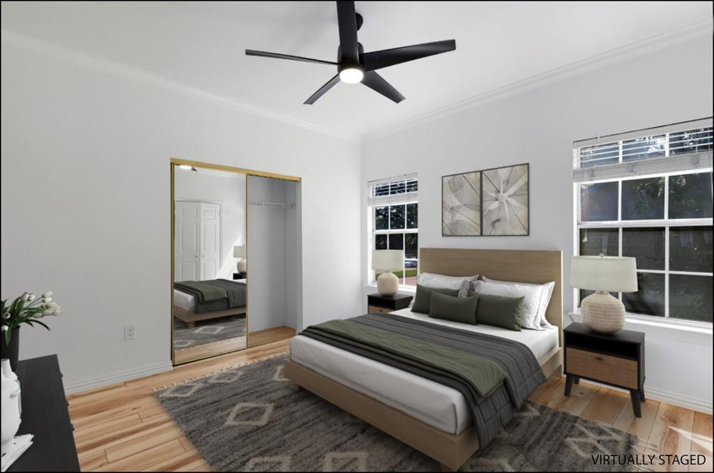 2601 Preston Road, Unit 1201 Plano, TX 75093 - Photo 15 of 31 Second Bedroom with crown molding, premium material LVP flooring, ceiling fan, and a closet