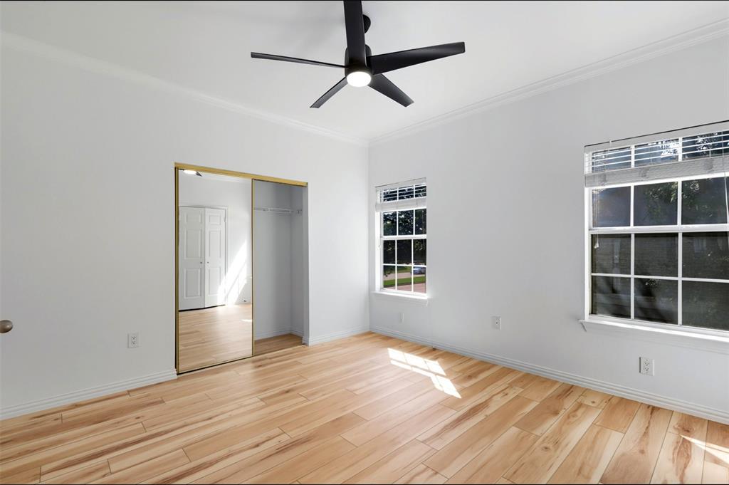 2601 Preston Road, Unit 1201 Plano, TX 75093 - Photo 16 of 31 Second Bedroom with crown molding, premium material LVP flooring, ceiling fan, and a closet