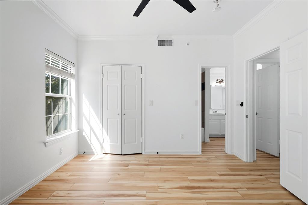 2601 Preston Road, Unit 1201 Plano, TX 75093 - Photo 17 of 31 Second Bedroom with crown molding, premium material LVP flooring, ceiling fan, and a closet