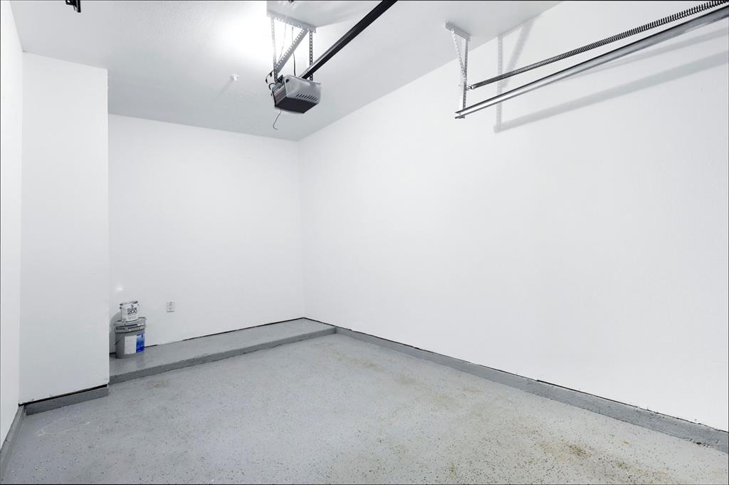 2601 Preston Road, Unit 1201 Plano, TX 75093 - Photo 25 of 31 Single-car garage with epoxy flooring