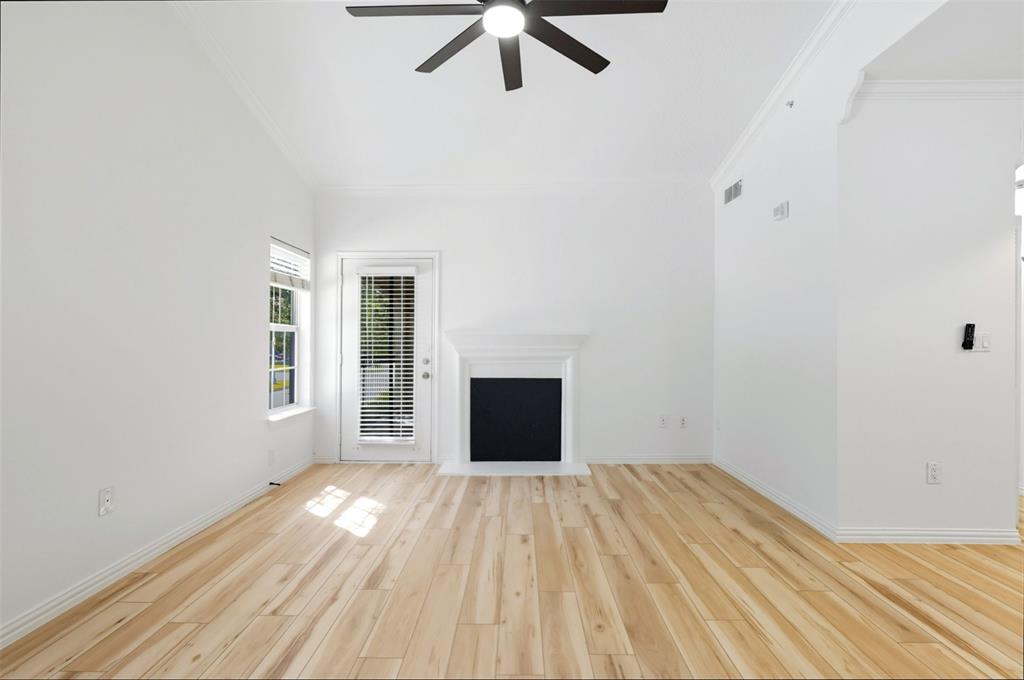 2601 Preston Road, Unit 1201 Plano, TX 75093 - Photo 5 of 31 living room with premium material LVP finished floors, a ceiling fan, and vaulted ceiling