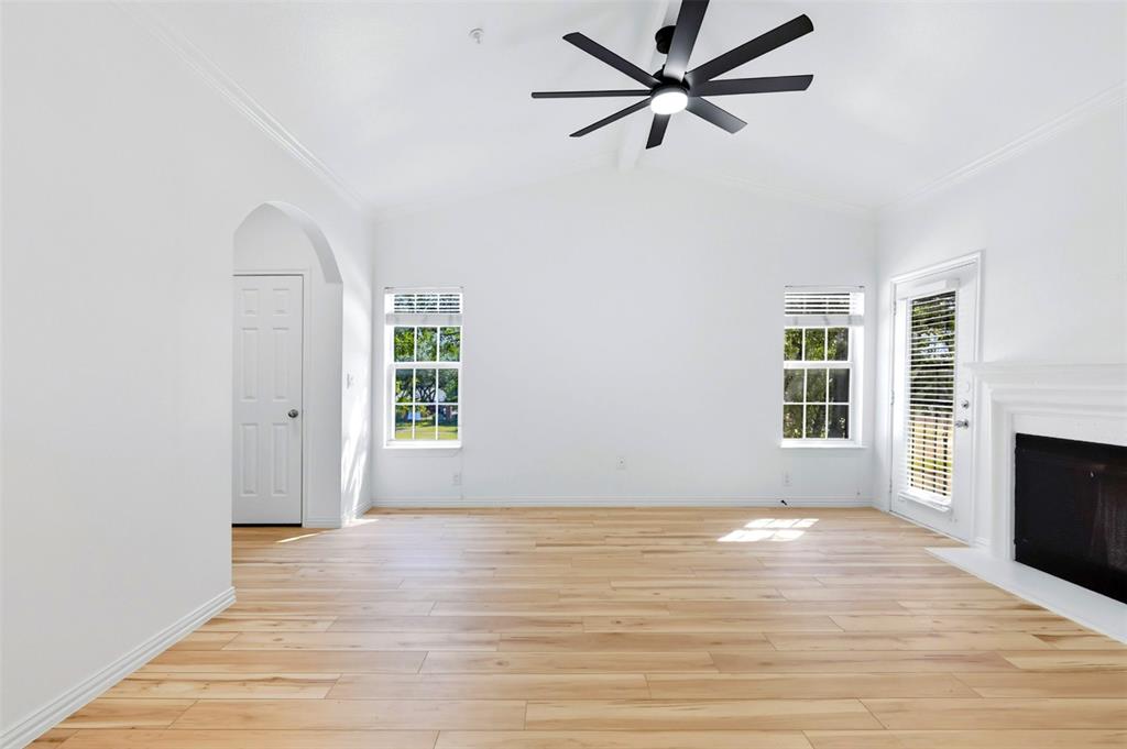 2601 Preston Road, Unit 1201 Plano, TX 75093 - Photo 6 of 31 living room with premium material LVP finished floors, a ceiling fan, and vaulted ceiling