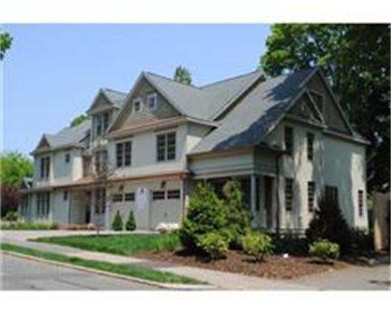 8 Rice Street, Unit 8 Wellesley, MA 02481 - Photo 1 of 10 a front view of a house with a yard