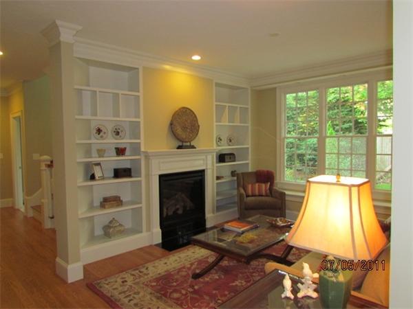 8 Rice Street, Unit 8 Wellesley, MA 02481 - Photo 3 of 10 a living room with furniture and a fireplace