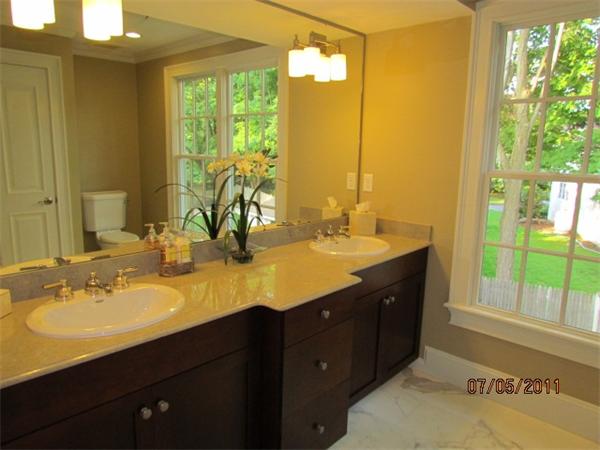 8 Rice Street, Unit 8 Wellesley, MA 02481 - Photo 6 of 10 a bathroom with a double vanity sink and a mirror