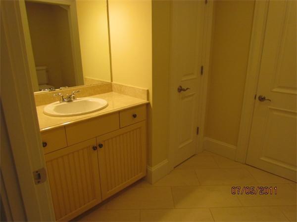 8 Rice Street, Unit 8 Wellesley, MA 02481 - Photo 10 of 10 a bathroom with a sink and a mirror