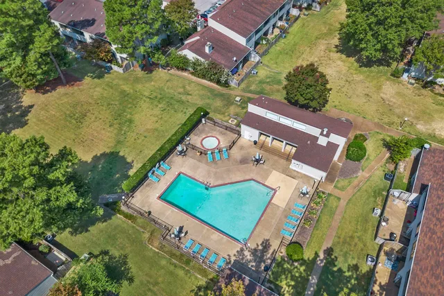 an aerial view of a house with a swimming pool