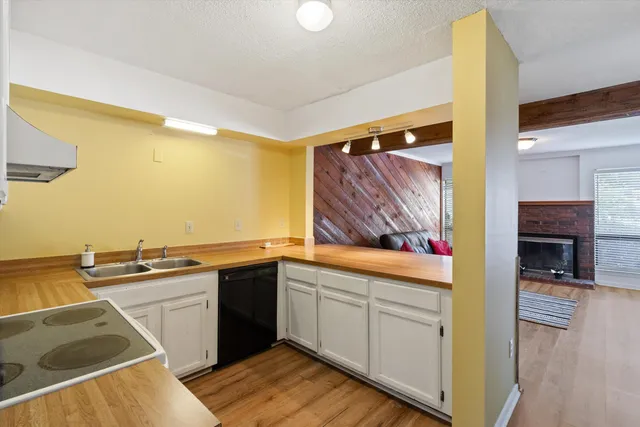 a kitchen with a sink and cabinets