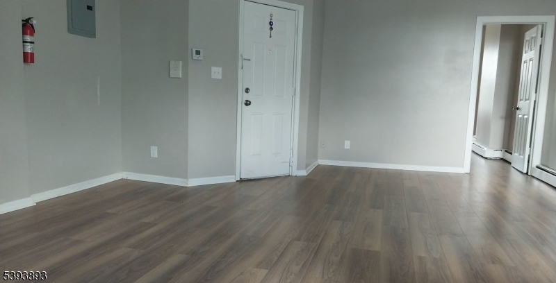 169 Mt Prospect Avenue Newark, NJ 07104 - Photo 11 of 16 a view of a room with wooden floor and window