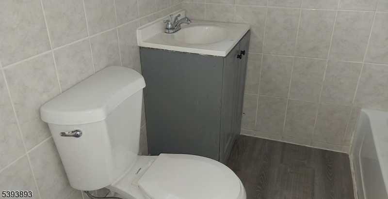 169 Mt Prospect Avenue Newark, NJ 07104 - Photo 13 of 16 a white toilet sitting next to a white sink